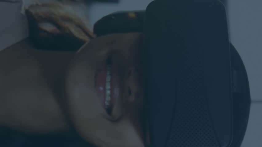 Animation of financial data processing over businesswoman using vr headset. Digitally generated image. - Powered by Shutterstock - Get 15% off with code: PIKWIZARD15