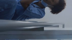 Animation of media icons over african american female doctor using smartphone. Global business and digital interface concept digitally generated video. - Powered by Shutterstock - Get 15% off with code: PIKWIZARD15