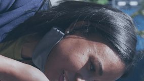 Animation of social media icons and numbers over woman in face mask with smartphone. Global social media, business, cloud computing and data processing concept digitally generated video. - Powered by Shutterstock - Get 15% off with code: PIKWIZARD15