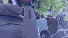 Animation of media icons over african american businessman with face mask. Global business and digital interface concept digitally generated video. - Powered by Shutterstock - Get 15% off with code: PIKWIZARD15