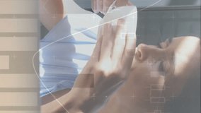 Animation of statistics and data processing over woman drinking coffee and using laptop. global business, data processing and technology concept digitally generated video. - Powered by Shutterstock - Get 15% off with code: PIKWIZARD15