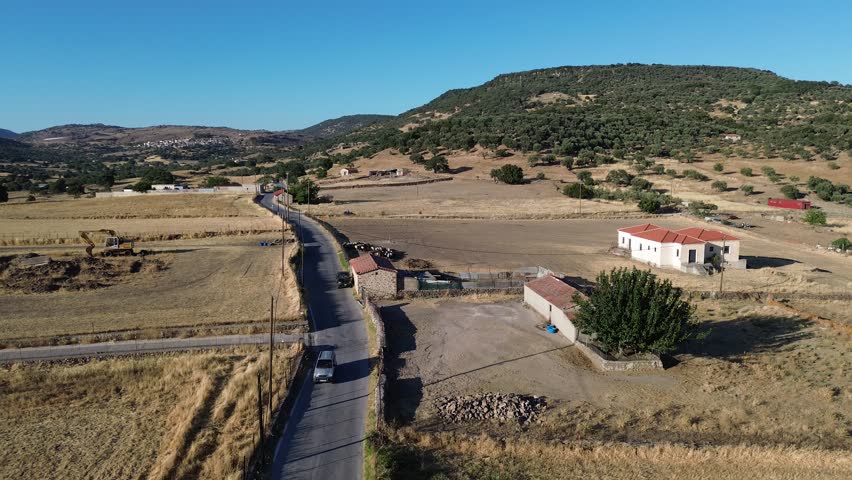 Agia Paraskevi, Island Lesvos, Greece - July 14th, 2025 - footage of traditional land-locked village in the central part of the island, fields, mountains, school, trees, temples and streets 