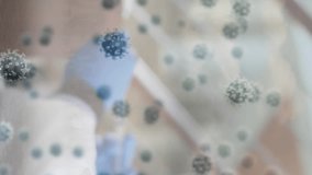 Animation of virus cells over african american male doctor in face mask vaccinating boy. Health, medicine and covid 19 pandemic concept digitally generated video. - Powered by Shutterstock - Get 15% off with code: PIKWIZARD15