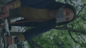 Animation of colorful social media notifications and computer icons over woman riding bicycle. Digital composite, covid, transportation, global connection and technology concept. - Powered by Shutterstock - Get 15% off with code: PIKWIZARD15