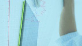 Animation of graphs moving over caucasian businessman drawing on graphics tablet and using computer. Digital composite, business, report, infographic, technology, data processing, hands, office. - Powered by Shutterstock - Get 15% off with code: PIKWIZARD15