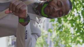 Animation of notification bars, african american man looking at smartwatch while talking on phone. Digital composite, multiple exposure, business, social media reminder and technology concept. - Powered by Shutterstock - Get 15% off with code: PIKWIZARD15