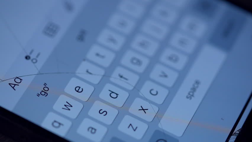 A cell phone keyboard with the letters Q, W, E, R, T, Y, U, I, O, P, A, S, D, F, G, H, J, K, L, Z, X, C