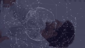 Two colleagues are speaking to each other during a meeting in the office one of them is smiling the other one has a serious expression the video then shows a globe with light trails and a network of - Powered by Shutterstock - Get 15% off with code: PIKWIZARD15