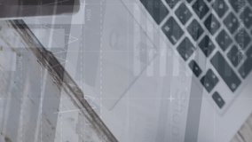 Animation of statistical data processing against laptop, smartphone and glasses on wooden table. Business data technology concept - Powered by Shutterstock - Get 15% off with code: PIKWIZARD15