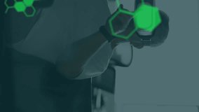 Animation of chemical compounds and medical data processing over man wearing vr headset. science and data processing concept digitally generated video. - Powered by Shutterstock - Get 15% off with code: PIKWIZARD15