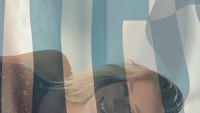 Animation of flag of greece waving over smiling caucasian woman standing against sea at beach. Digital composite, multiple exposure, holiday, vacation, freedom and patriotism concept. - Powered by Shutterstock - Get 15% off with code: PIKWIZARD15