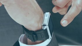 Animation of data processing over caucasian man checking smartwatch. Global sport and digital interface concept digitally generated video. - Powered by Shutterstock - Get 15% off with code: PIKWIZARD15