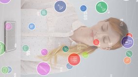 Animation of network of connections with icons over businesswoman using tablet. Global connections, business, finance, computing and data processing concept digitally generated video. - Powered by Shutterstock - Get 15% off with code: PIKWIZARD15