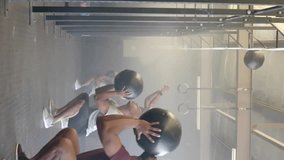 Animation of business icons over diverse people exercising with balls at gym. Sport and digital interface concept digitally generated video. - Powered by Shutterstock - Get 15% off with code: PIKWIZARD15