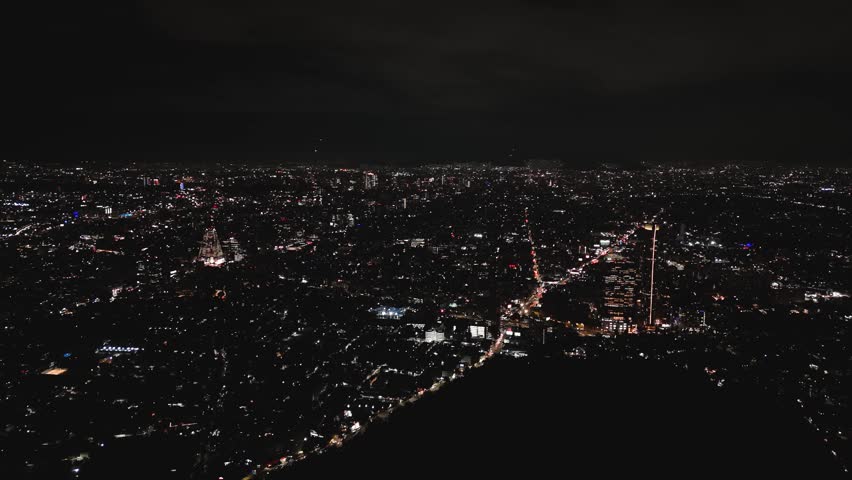 Clear night in Mexico City, high-altitude drone view