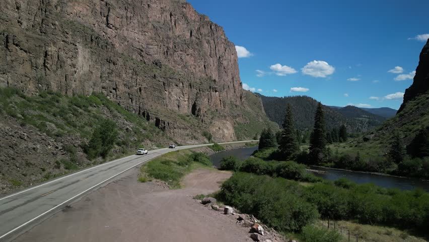 Aerial of Rio Grande River in Creede Colorado in canyon next to highway 149