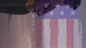 Animation of usa flag effect against couple embracing each other at the beach. Independence day celebration and holiday concept - Powered by Shutterstock - Get 15% off with code: PIKWIZARD15