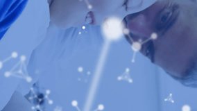 Animation of molecules over caucasian male dentist and boy patient. Global medicine, healthcare and digital interface concept digitally generated video. - Powered by Shutterstock - Get 15% off with code: PIKWIZARD15