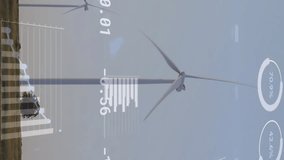 Animation of financial data processing over wind turbines on field. Global ecology, finances, energy and digital interface concept digitally generated video. - Powered by Shutterstock - Get 15% off with code: PIKWIZARD15