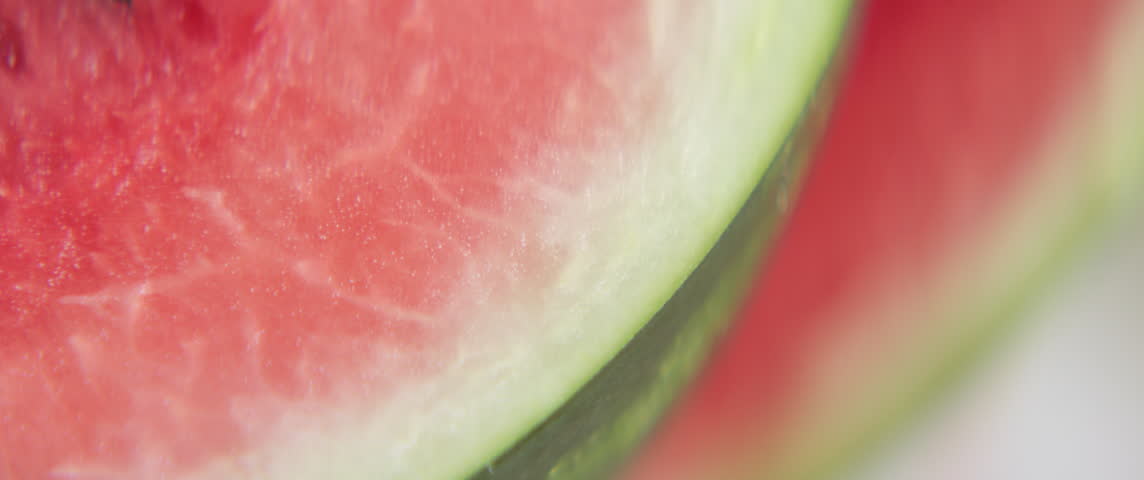 Rind and juicy flesh of watermelon close-up 5.7K anamorphic video