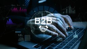 Hands typing on keyboard with B2B concept overlay, featuring global data charts and analytics for digital corporate business solutions. - Powered by Shutterstock - Get 15% off with code: PIKWIZARD15