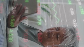 Animation of financial data processing over senior woman using tablet at home. global finance, business and communication concept digitally generated video. - Powered by Shutterstock - Get 15% off with code: PIKWIZARD15