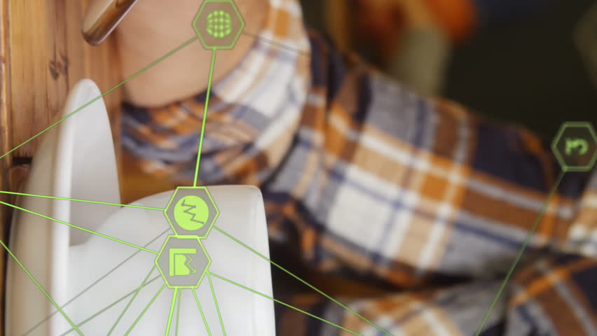 Globe of digital icons against mid section of man using smartphone and drinking coffee at a cafe. global networking and technology concept - Powered by Shutterstock - Get 15% off with code: PIKWIZARD15