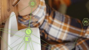 Globe of digital icons against mid section of man using smartphone and drinking coffee at a cafe. global networking and technology concept - Powered by Shutterstock - Get 15% off with code: PIKWIZARD15