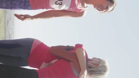 Animation of social media notifications, over female runners high fiving on beach. social media, positive feelings, wellbeing and communication network concept, digitally generated video. - Powered by Shutterstock - Get 15% off with code: PIKWIZARD15