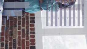 Animation of financial data processing over businesswoman talking on smartphone in office. global business, finances, connections and digital interface concept digitally generated video. - Powered by Shutterstock - Get 15% off with code: PIKWIZARD15