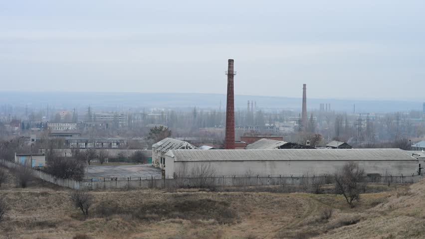 The industrial outskirts of Kramatorsk, Ukraine. Smokestacks and factory buildings dominate the landscape of this key city in the Donbas region, a focal point of the war.