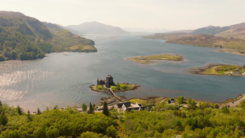 Aerial drone footage of Eilean Donan Castle, one of Scotland’s most iconic landmarks, located on a small tidal island