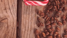 Animation of golden stars over christmas cookies, coffee beans and candy canes. Christmas, treats, tradition and celebration concept digitally generated video. - Powered by Shutterstock - Get 15% off with code: PIKWIZARD15