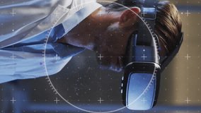 Animation of data processing over man using vr headset. Global online security, business, finance, computing and data processing concept digitally generated video. - Powered by Shutterstock - Get 15% off with code: PIKWIZARD15