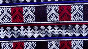 Close-up of traditional Yao Mien textile featuring intricate hand embroidery and colorful tribal patterns. This ethnic needlework reflects the rich cultural heritage and skilled craftsmanship of the Y - Powered by Shutterstock - Get 15% off with code: PIKWIZARD15