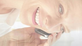 Animation of caucasian businesswoman using smartphone over people walking and cityscape. Global business, finances, digital interface, computing and data processing concept digitally generated video. - Powered by Shutterstock - Get 15% off with code: PIKWIZARD15