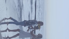 Multiple red heart icons floating against caucasian couple kissing on the beach. social media networking and technology concept - Powered by Shutterstock - Get 15% off with code: PIKWIZARD15