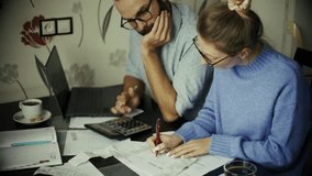 Couple Reviewing Household Finances And Bills. Financial Planning. Managing Expenses and Debt Management. Tax Preparation Home Accounting. Personal Finance Money Management. Financial Literacy Budget - Powered by Shutterstock - Get 15% off with code: PIKWIZARD15