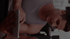 Animation of financial data processing over woman with her personal trainer discussing in the gym in the background. Global finance business interface concept digitally generated image. - Powered by Shutterstock - Get 15% off with code: PIKWIZARD15