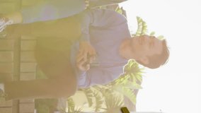 Animation of gold house key and key fob over diverse couple drinking tea at new home. House, home, property, ownership and lifestyle concept digitally generated video. - Powered by Shutterstock - Get 15% off with code: PIKWIZARD15