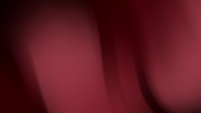 Closeup of draped maroon fabric, suitable for backgrounds, textures, fashion design, or abstract concepts in graphic design or photography projects.