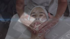 Spa therapist placing hands under client chin starting 3D scans giving upward massage for analysis. Wellness, futuristic, holographic, relaxation, technology, skincare, health - Powered by Shutterstock - Get 15% off with code: PIKWIZARD15