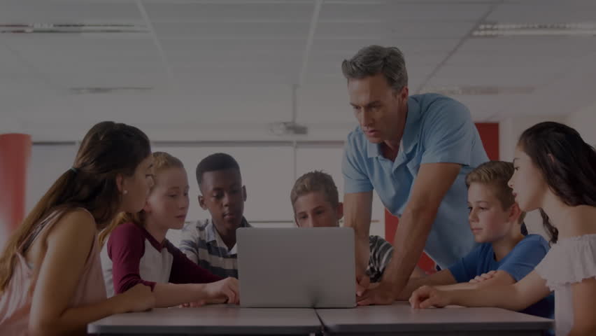 Teacher pointing at laptop starting coding lesson while students leaning and binary digits drifting. Education, teamwork, digital, innovation, classroom, collaboration, futuristic - Powered by Shutterstock - Get 15% off with code: PIKWIZARD15