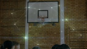 Coach guiding team huddle under hoop during timeout, sketching play diagrams with pen on clipboard. Athletic, teamwork, strategy, mentorship, sportsmanship, motion, focus - Powered by Shutterstock - Get 15% off with code: PIKWIZARD15