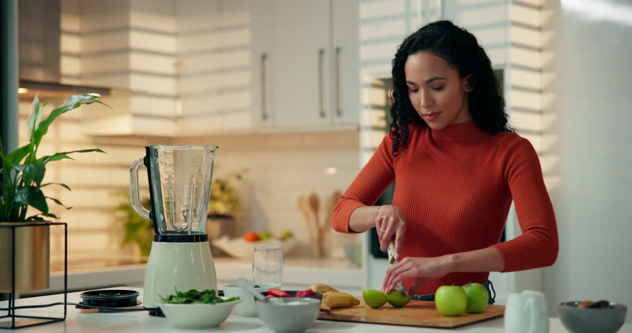 Smoothie, woman and cutting apples in kitchen for breakfast drink, meal replacement or prepare fruit. Blender, person and ingredients in home for organic shake, healthy beverage and digestive health