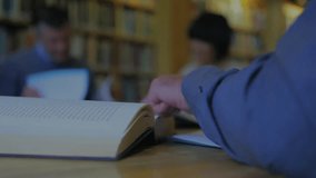 Study duo placing hand on open book, flipping while creating animated padlock rings in education. Collaboration, concentration, learning, academic, knowledge, wisdom, teamwork - Powered by Shutterstock - Get 15% off with code: PIKWIZARD15