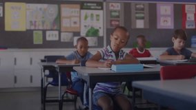 Schoolchildren writing at classroom desks starting floating data icons with network lines forming. Education, technology, collaboration, digital, learning, innovation, youthful - Powered by Shutterstock - Get 15% off with code: PIKWIZARD15