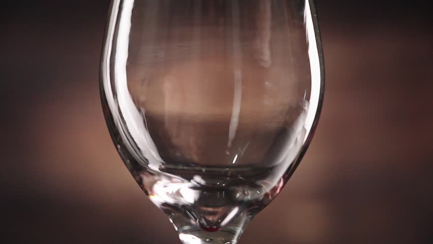 Elegance of tasty Red Wine Pouring into a glass,