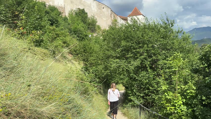 Caucasian tourist visiting Rasnov fortress near Brasov, Romania