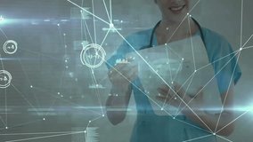 Medical professional using tablet, reviewing patient data, holographic charts pulsing around figure. Healthcare, innovation, technology, futuristic, analytics, digital, precision - Powered by Shutterstock - Get 15% off with code: PIKWIZARD15